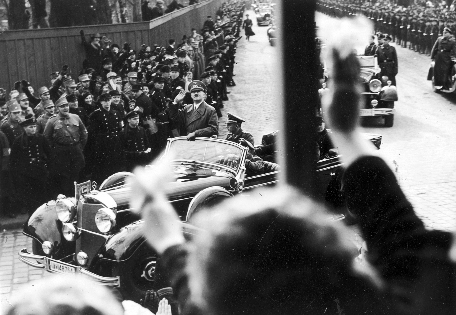 Citizens of Klaipeda welcome Adolf Hitler as he crosses the city of Memel